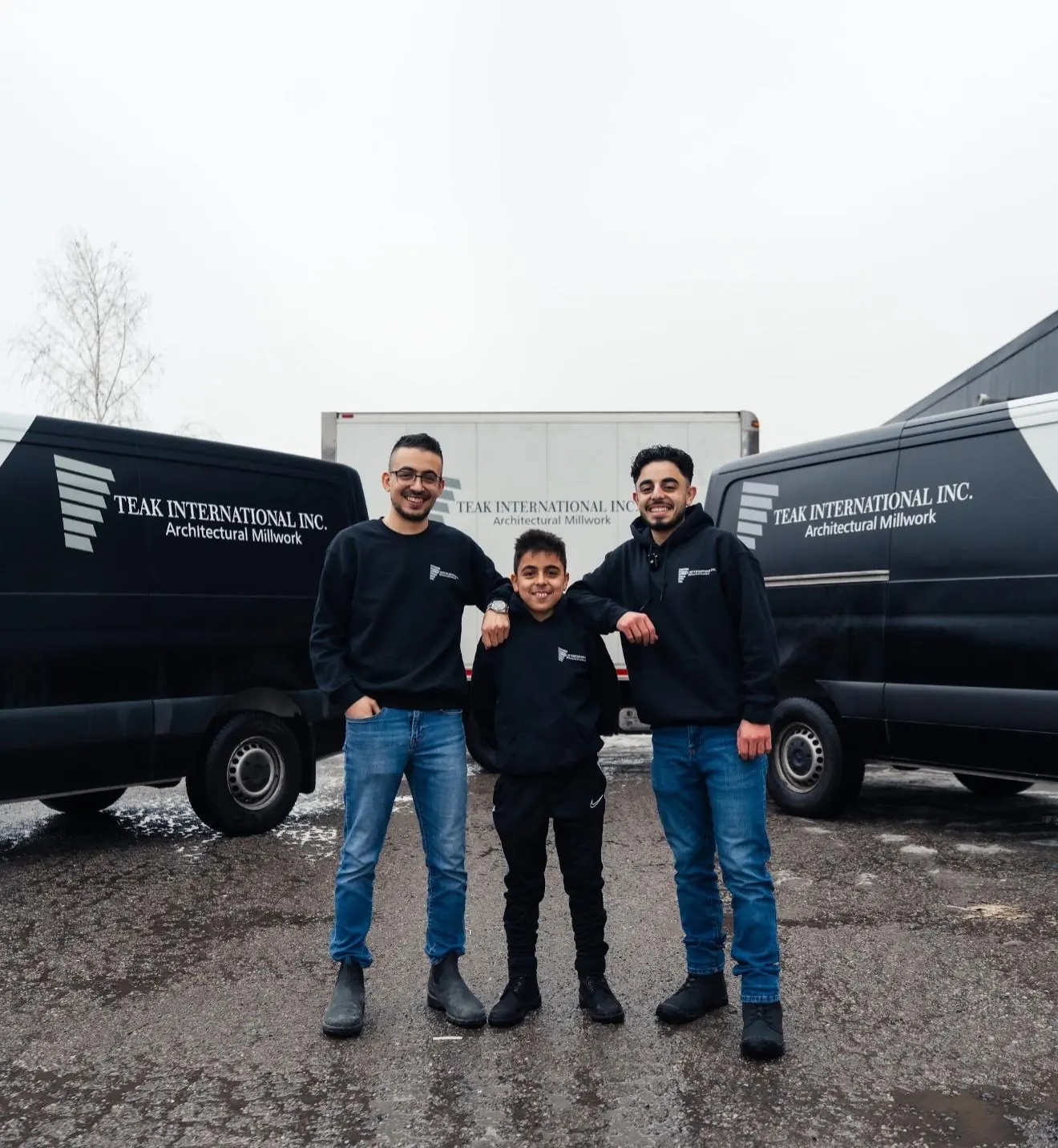 Kevin, Ryan and Steven in front of the Teak International vans
